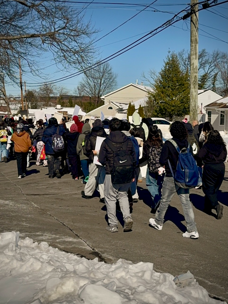 Edison High School students march together against ICE enforcement during a peaceful protest in Edison, New Jersey